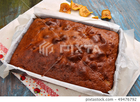 Pie on a baking sheet for roasting. 49476792