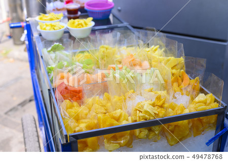 Fresh fruit packed in cart ready to sell on the st 49478768