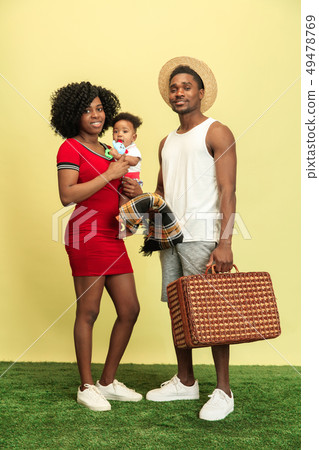 Happy family having picnic at studio 49478769