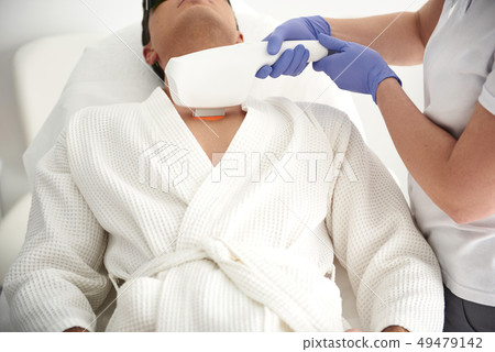 Close up of laser epilation procedure for man Close up of laser epilation procedure for man 49479142