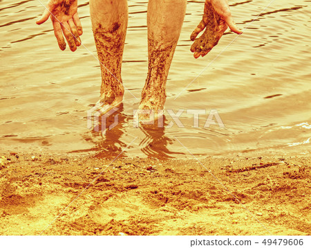 Mud race runners running over obstacles extreme 49479606