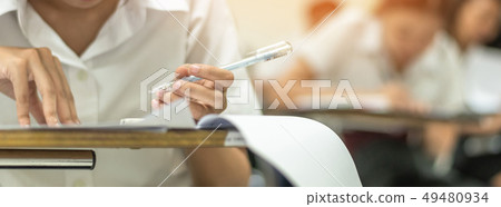 School student taking educational exam in class School student taking educational exam in class 49480934