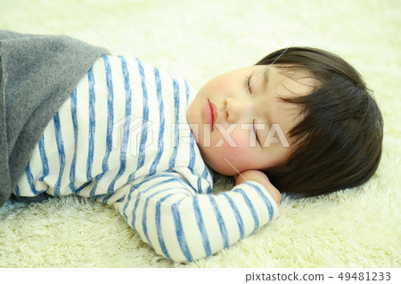 Boy taking a nap Boy taking a nap 49481233