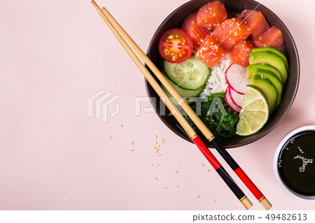Hawaiian salmon poke salad with rice, vegetables 49482613