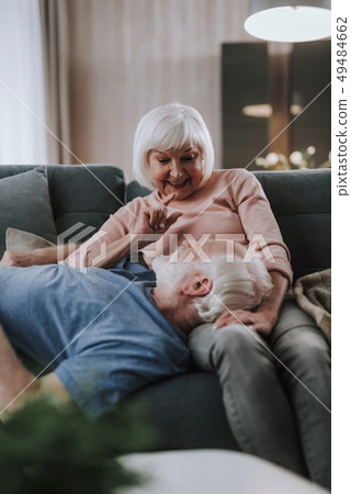 Happy elder couple having fun together on sofa 49484662