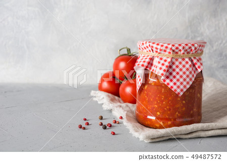 Vegetable sauce adjika with tomatoes, garlic. Vegetable sauce adjika with tomatoes, garlic. 49487572