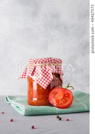 Vegetable sauce adjika with tomatoes, garlic. Vegetable sauce adjika with tomatoes, garlic. 49487573
