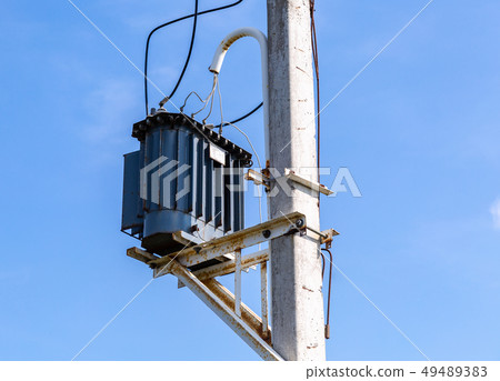 Transformer of high power station on the pillar 49489383