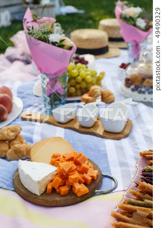 wooden tray with cheese assorti, pastillum rolls wooden tray with cheese assorti, pastillum rolls 49490329