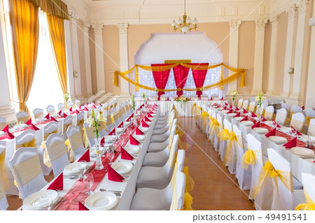 Large dining hall with tables set up 49491541