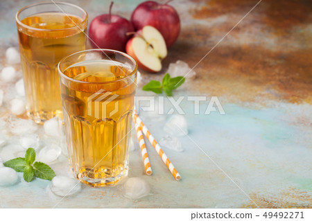 Two glasses of red Apple juice. Two glasses of red Apple juice. 49492271