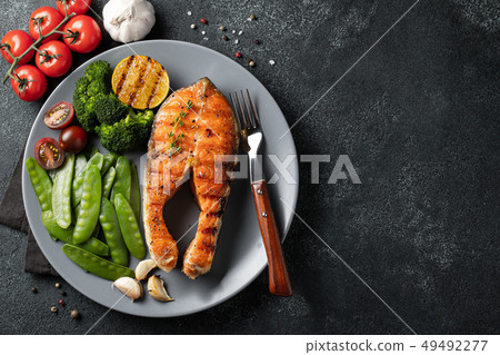 Tasty and healthy salmon steak. Tasty and healthy salmon steak. 49492277