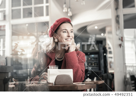 Kind mature woman being deep in her thoughts Kind mature woman being deep in her thoughts 49492351