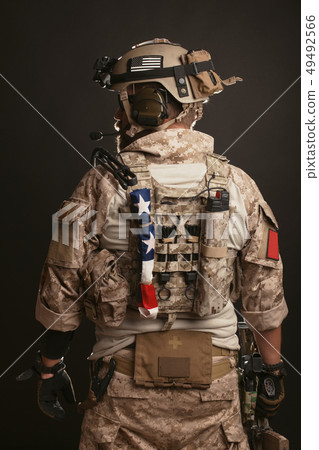 Brutal man in the military desert uniform. Brutal man in the military desert uniform. 49492566