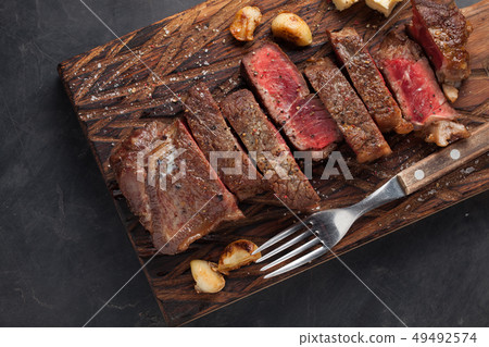 Closeup ready to eat steak new York. 49492574