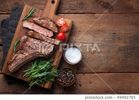 Grilled cowboy beef steak. 49492765
