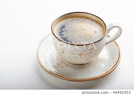 White Cup with cappuccino coffee. 49492953