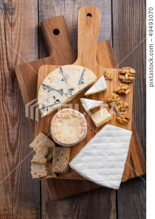 Tasting cheese dish on a wooden background. 49493070