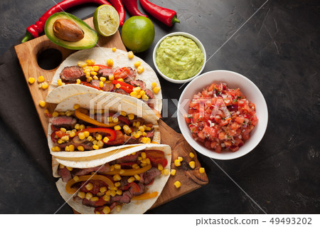 Mexican tacos with marbled beef and vegetables. Mexican tacos with marbled beef and vegetables. 49493202