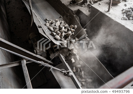 Industrial belt conveyor moving raw materials from mine 49493796
