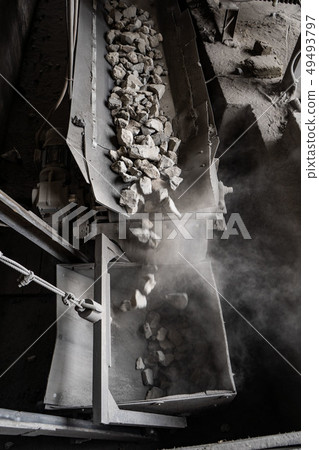 Industrial belt conveyor moving raw materials from mine 49493797