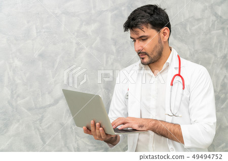 Doctor using laptop computer at the hospital. Doctor using laptop computer at the hospital. 49494752