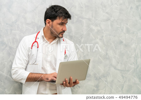 Doctor using laptop computer at the hospital. 49494776