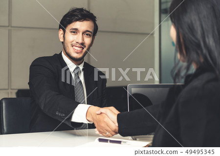Business people handshake agreement in office. 49495345