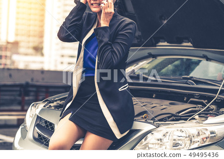 Woman whose car breakdown call for repair service. Woman whose car breakdown call for repair service. 49495436