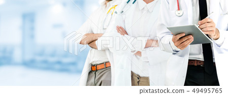 Doctor working in hospital with other doctors. 49495765