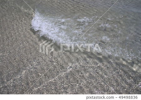Close up littel wave on sand 49498836