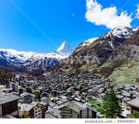 Zermatt village and Matterhorn Peak in background. Zermatt village and Matterhorn Peak in background. 49499903