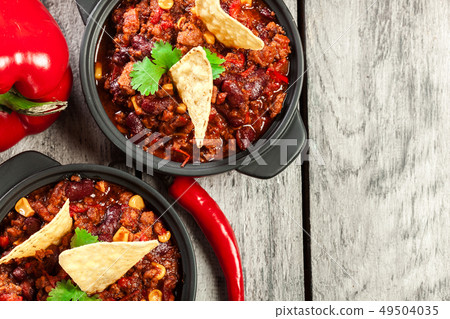 Bowls of hot chili con carne with ground beef, Bowls of hot chili con carne with ground beef, 49504035