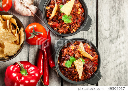 Bowls of hot chili con carne with ground beef, Bowls of hot chili con carne with ground beef, 49504037