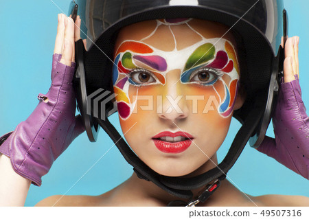 Young model with bright creative make up with 49507316