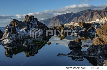 Los gigantes cliffs and Puerto de Santiago village Los gigantes cliffs and Puerto de Santiago village 49508130