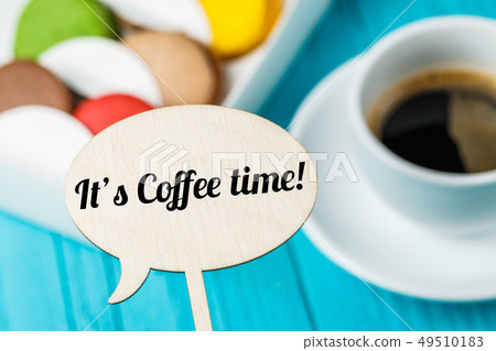 Inscription on topper ,macaroons ,coffee 49510183