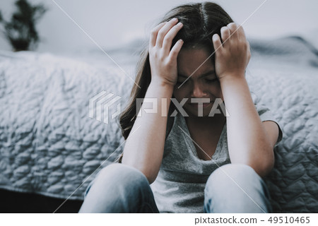 Child Looks Sad. Kid Head in Hands and Cries. 49510465