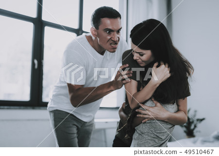 Man Grabbed Wife . Mother Protects Daughter . 49510467