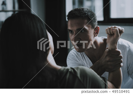 Family Quarrels. Husband Tightly Squeezing Hand. 49510491