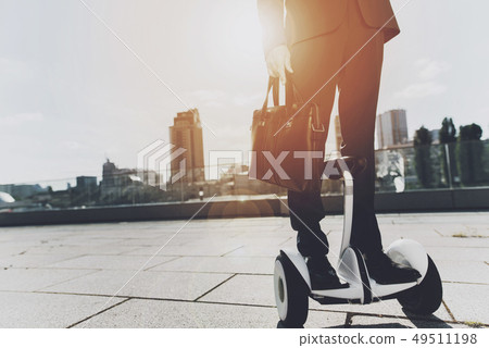 Businessman is Riding on Gyroboard Businessman is Riding on Gyroboard 49511198