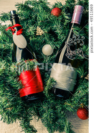 Photo of spruce branches with two bottles of wine, blank greeting card 49511669
