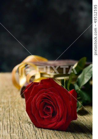 red rose, catalan flag and books 49512595