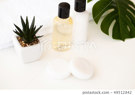 Wellness Products and Cosmetics. Spa still life with blossoms of rose and essential oils Wellness Products and Cosmetics. Spa still life with blossoms of rose and essential oils 49512842