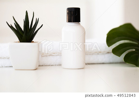 Wellness Products and Cosmetics. Spa still life with blossoms of rose and essential oils Wellness Products and Cosmetics. Spa still life with blossoms of rose and essential oils 49512843