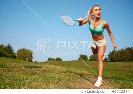 badminton player in action . Outdoor sport badminton player in action . Outdoor sport 49512874