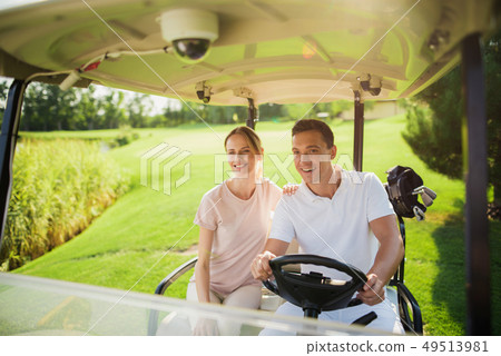 Golf Player Teeing the Ball Squatting on a Turf. 49513981