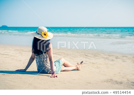 Asian girl on the beach Asian girl on the beach 49514454