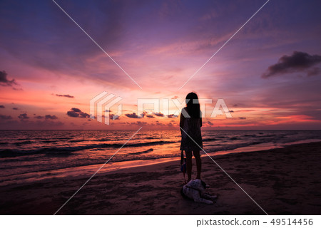 Silhouette of Asian girl on the beach on sunset Silhouette of Asian girl on the beach on sunset 49514456