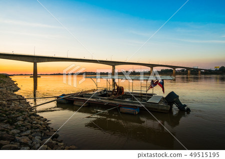 Thai-Laos Friendship Bridge on sunset background Thai-Laos Friendship Bridge on sunset background 49515195